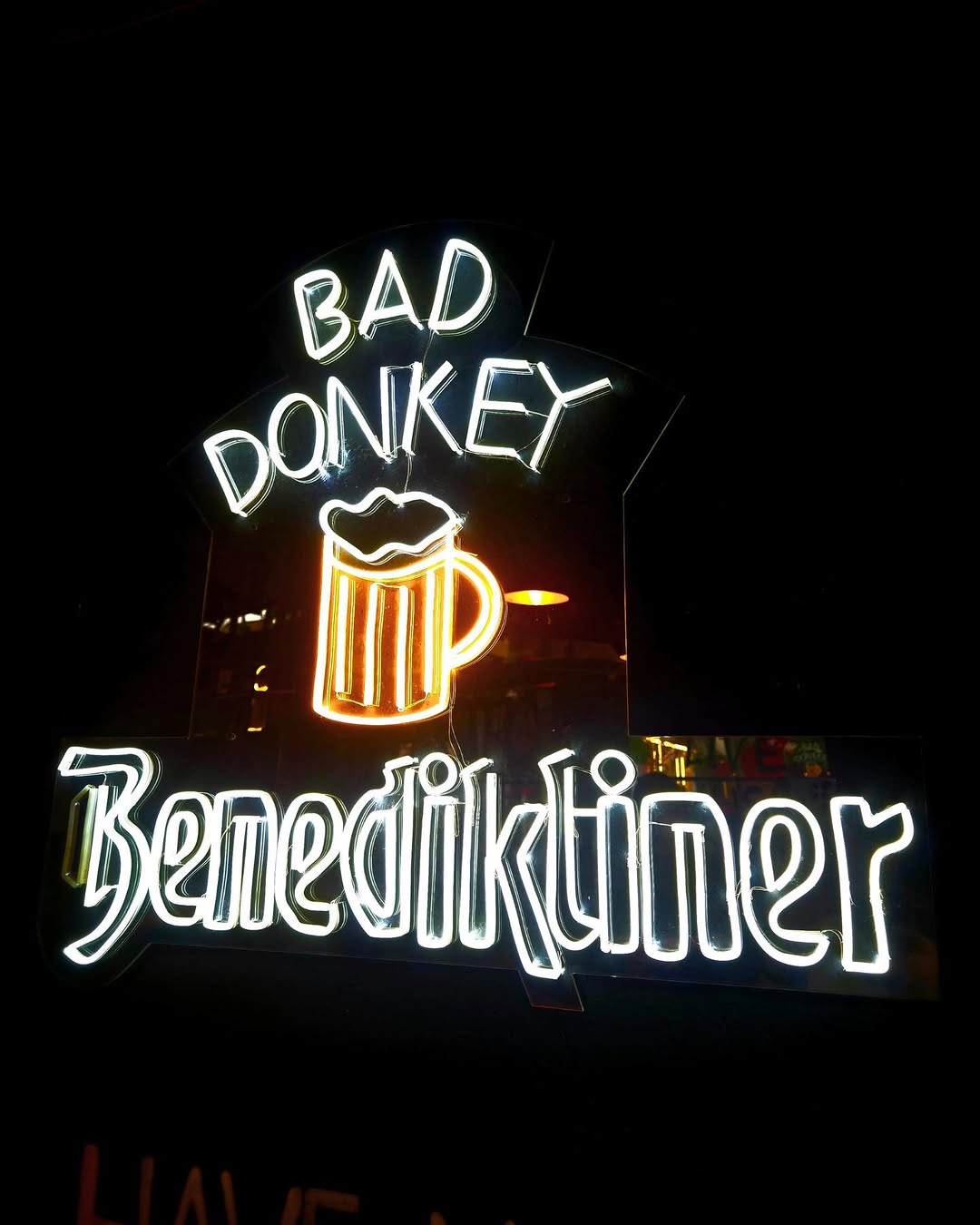 Bad Donkey Gastropub neon sign in Skopje at night